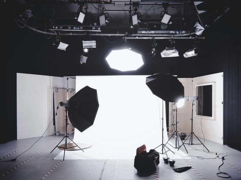 Video and Audio Production Studio Video and audio production studio with softbox lighting, overhead lighting rig and a white cyclorama backdrop
